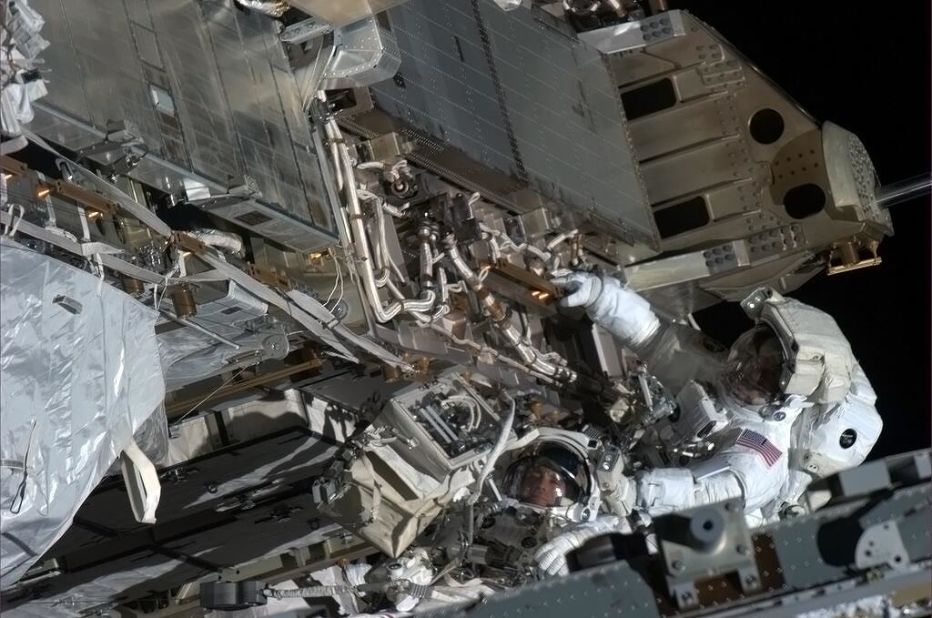 "Here's looking at you," tweeted Hadfield about this <a href="https://twitter.com/Cmdr_Hadfield/status/333319320136462336" target="_blank" target="_blank">spacewalk photo opportunity</a> with Tom Marshburn, a flight engineer. "Chris and Tom take a minute with visors to look up-sun at my camera in the window," reads the May 11 post.