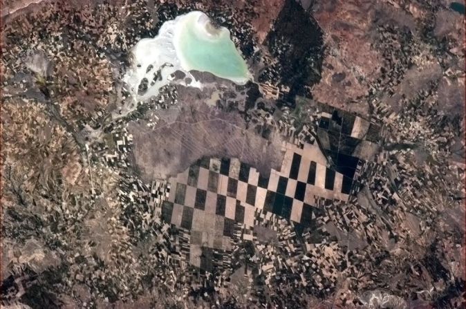 A <a href="https://twitter.com/Cmdr_Hadfield/status/332215204224057344" target="_blank" target="_blank">checkerboard scene</a> below. "Little farmers, big farmers and nature, in Turkey," Hadfield wrote on May 8.