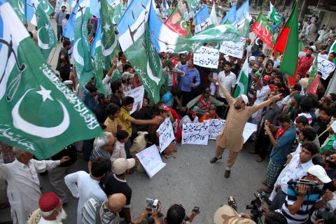 Supporters of politician Imran Khan shout slogans over allegations of election fraud during a protest in Hyderabad, Pakistan, on Monday, May 13. 