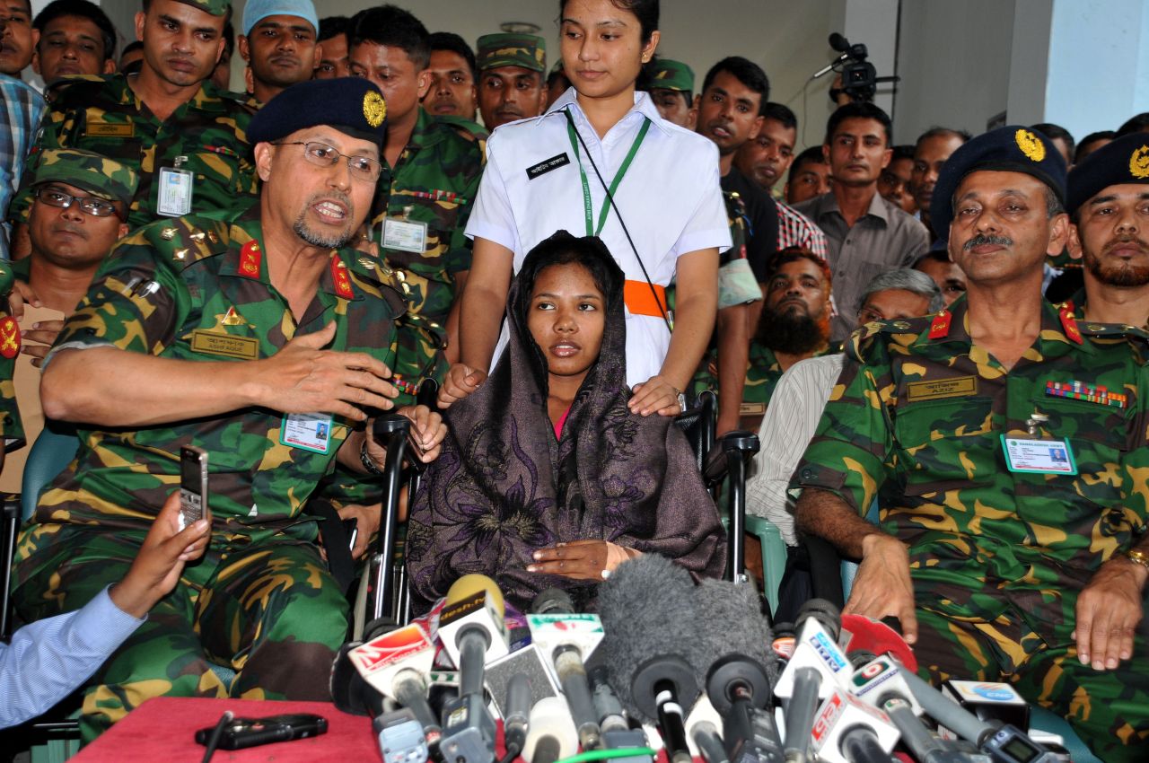 Begum is surrounded by media and members of the Bangladeshi military at the hospital where she is recovering in Dhaka on May 13.