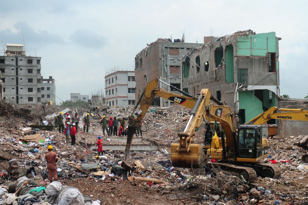 Bangladeshi army workers supervise the continued rescue operation using heavy equipment to sift through the rubble on May 10 in Dhaka.
