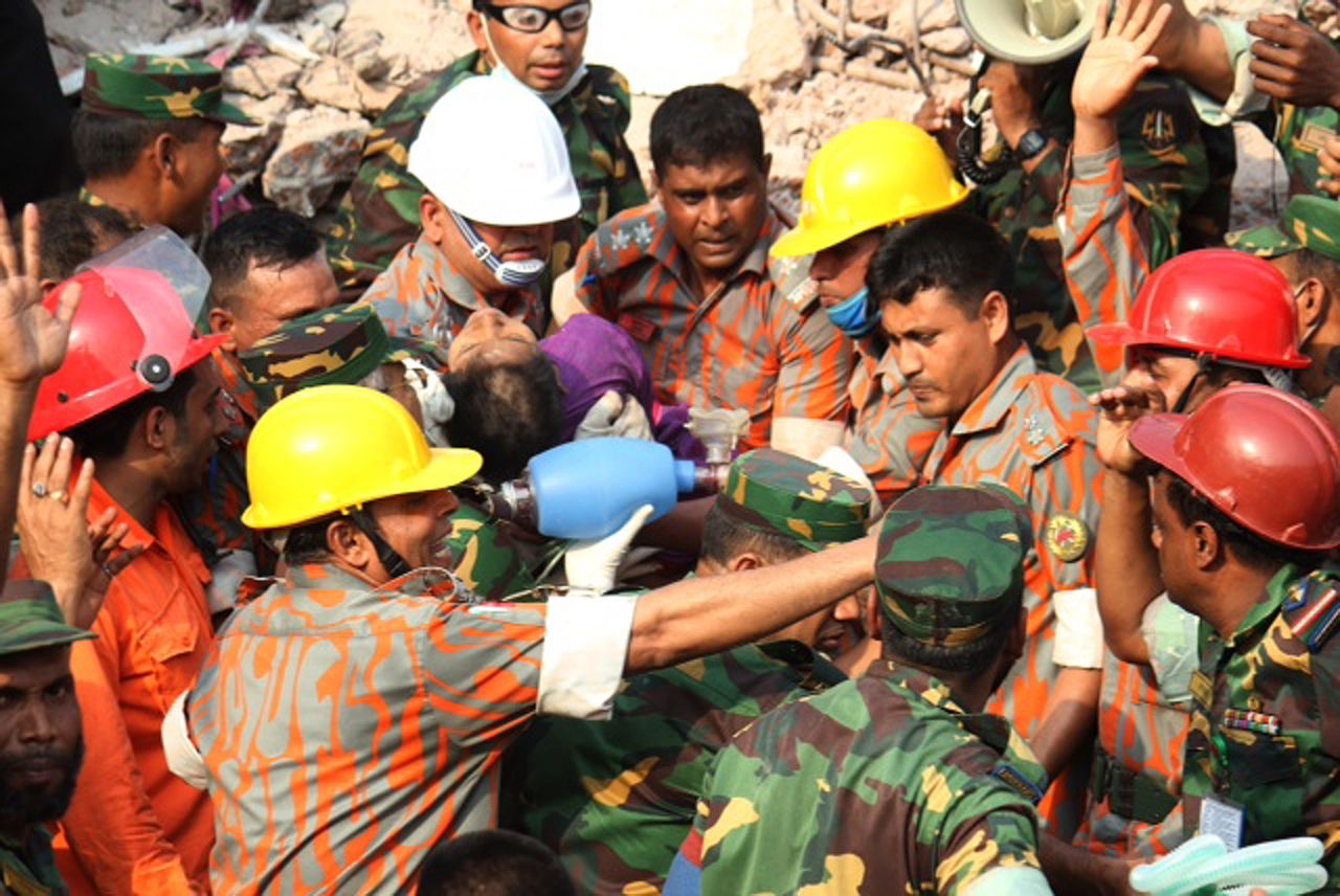 Begum is pulled alive from the rubble by the rescue workers on May 10, after being buried for 16 days.