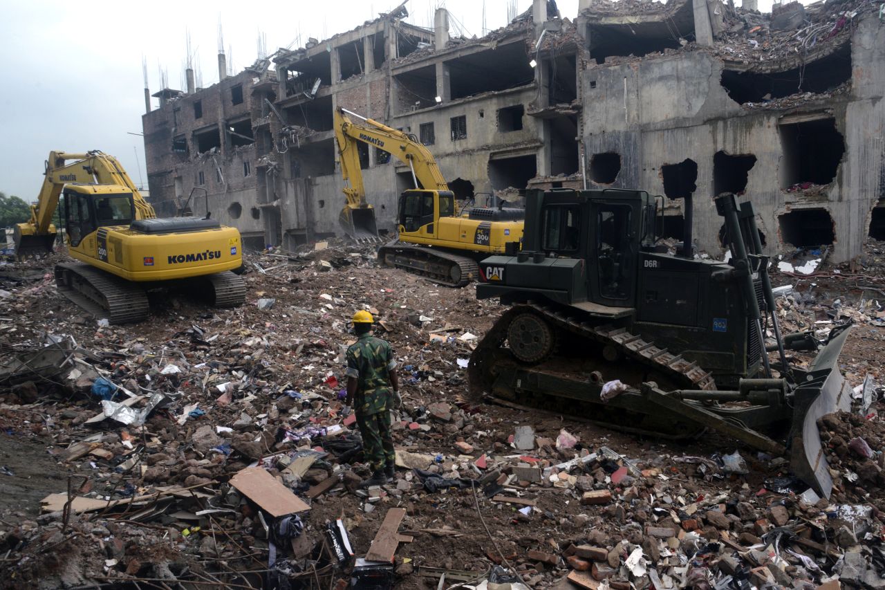 Heavy equipment sifts through the rubble of the garment factory building collapse on Sunday, May 12. 