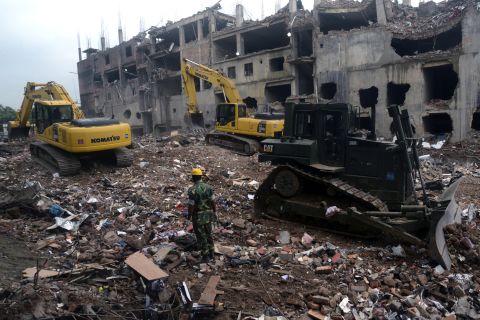 Heavy equipment sifts through the rubble of the garment factory building collapse on Sunday, May 12. 