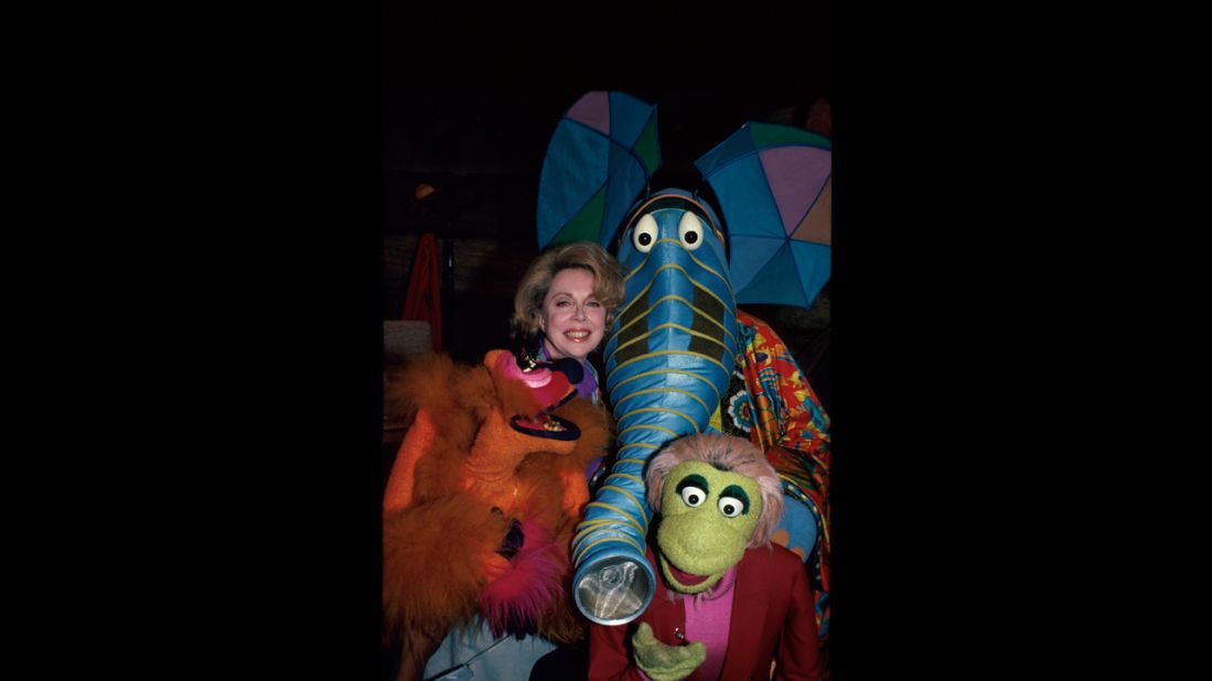 Brothers poses with characters from "The Great Space Coaster."