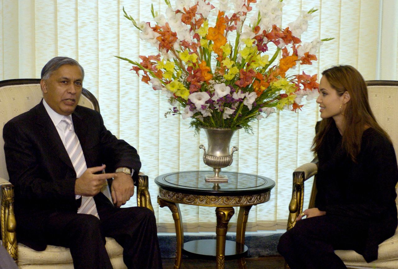 As part of her role as goodwill ambassador, Jolie speaks with Pakistani Prime Minister Shaukat Aziz in Islamabad, Pakistan, in May 2005.