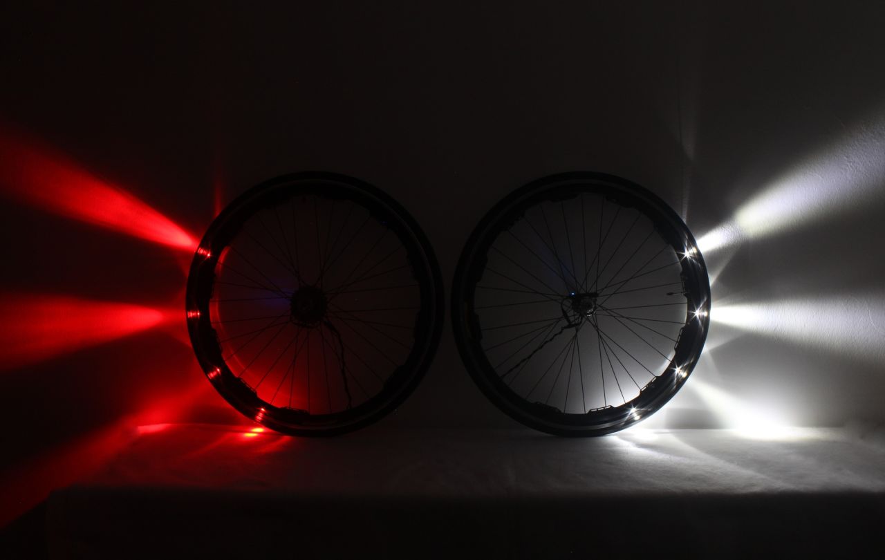 A ring of white and red LEDs are installed around the entire rim of the front and back wheels, acting as headlights and taillights 