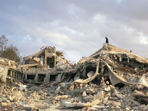 Anthony Bourdain atop the rubble that was once Moammar Gadhafi's compound in Tripoli.