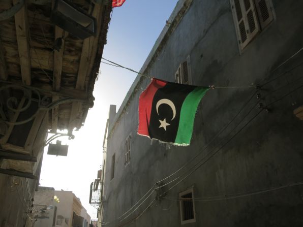 A Libyan flag hangs in an alleyway in Old Town, Tripoli. 