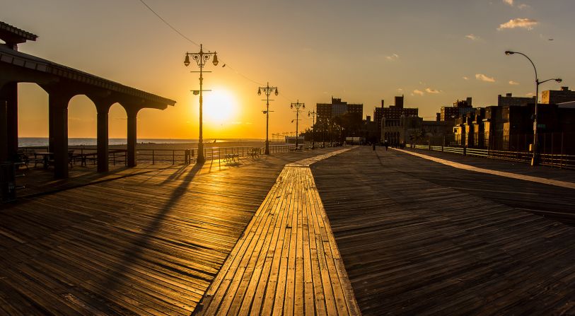 The first boardwalk was built in Atlantic City in 1870, when a railroad conductor was asked to find a way to prevent sand from filling shorefront hotel entryways. Coney Island (pictured) in New York also includes roller coasters, carnival attractions and other slices of Americana.