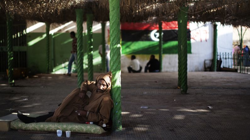 A man relaxes on the patio outside a mosque in Tripoli on October 26, 2011.