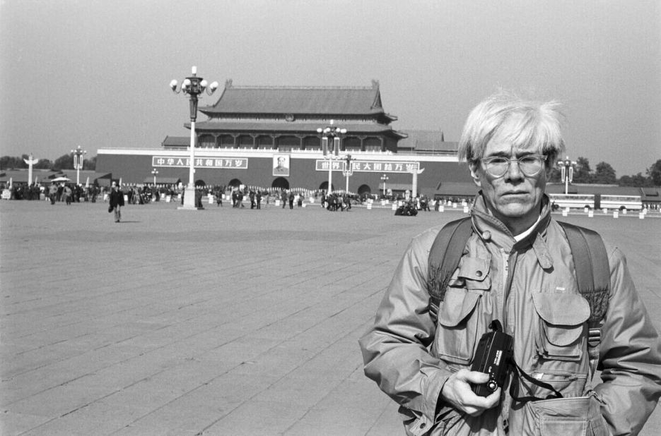 During his first and only trip in China, Warhol is pictured in front of Tiananmen Square in Beijing, with its iconic portrait of Chairman Mao in November 1982.