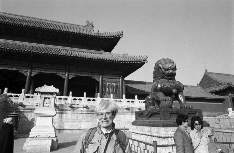 After signing as a model with Ford Agency, Warhol began considering how to pose for the camera.  Warhol experimented with poses in front of his friend and personal photographer, Christopher Makos.  Here, he imitates the expression of one of the guardian lions in Beijing's Forbidden City. 