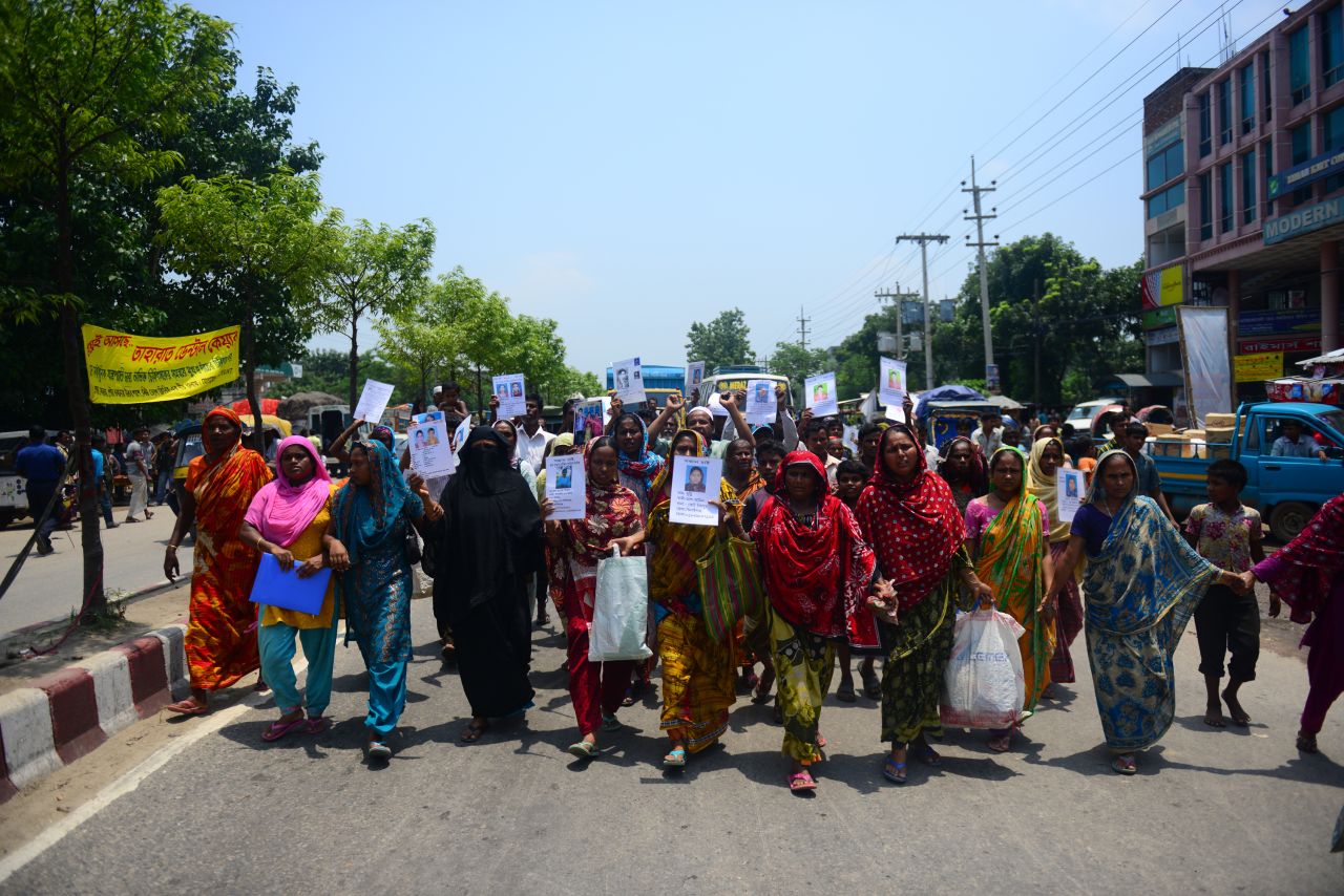 Marching Bangladeshis hold up portraits of relatives missing in the Rana Plaza building collapse on Tuesday, May 14. They're demanding wages for the missing garment workers and the death sentence for the building owner. Rana Plaza collapsed on April 24 in Savar outside Dhaka; <a href="http://www.cnn.com/2013/05/14/world/asia/bangladesh-building-collapse-aftermath/?hpt=hp_t2">the final death toll stands at 1,127.</a>