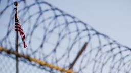 This image reviewed by the US military shows the flag and barbed wire within the 'Camp Six' detention facility of the Joint Detention Group at the US Naval Station in Guantanamo Bay, Cuba, January 19, 2012.