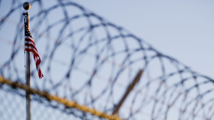 This image reviewed by the US military shows the flag and barbed wire within the 'Camp Six' detention facility of the Joint Detention Group at the US Naval Station in Guantanamo Bay, Cuba, January 19, 2012.