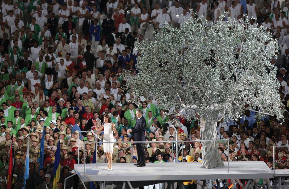 Addressing the world at the opening ceremony of Athens 2004, Angelopoulos is accompanied by  IOC President Jacques Rogge. 