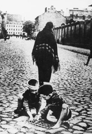 With the walls cutting the ghetto off from essential supplies, many people were left starving. This picture shows a scene from a street in the ghetto in circa 1941.