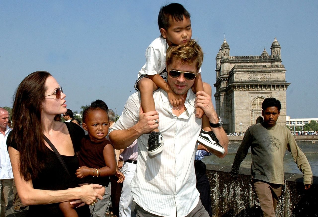 Here the proud mother holds daughter Zahara as partner Brad Pitt carries son Maddox during a stroll on the seafront promenade at the historic Gateway of India outside their hotel in Mumbai on November 12, 2006. 