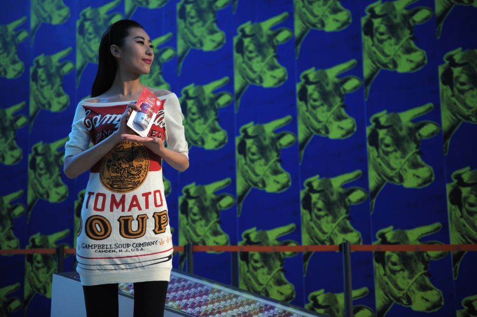 A model, wearing a Campbell's Soup dress in a nod to Andy Warhol's iconic pop art, stands at the "Andy Warhol: 15 Minutes Eternal" exhibition currently showing in Shanghai.