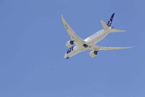 A LOT Polish Airlines 787, with a redesigned lithium-ion battery system, performs a test flight at Paine Field in Everett, Washington. The Dreamliner's distinctive wings sweep back at 32 degrees. 