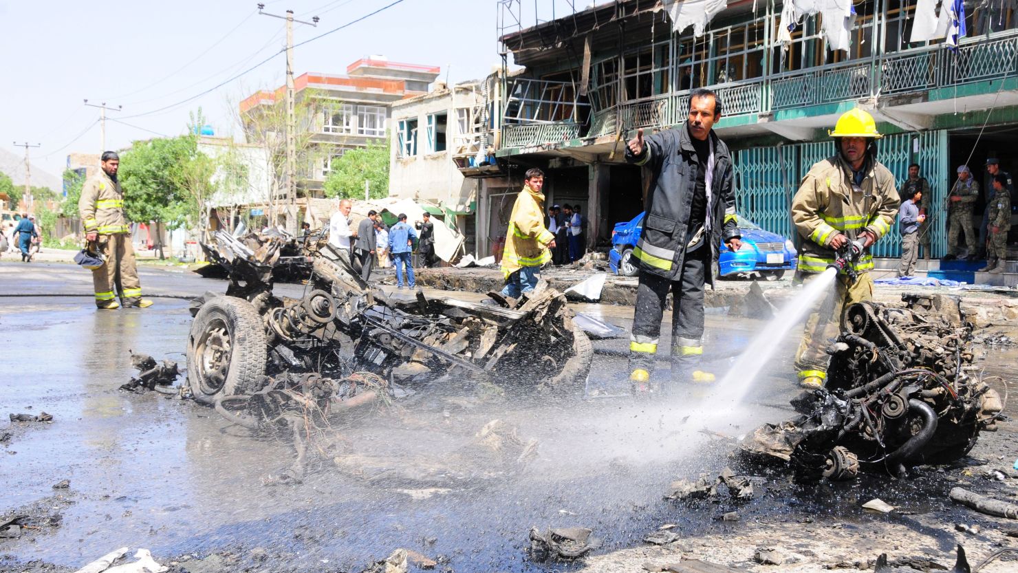 Firefighters work at the site of a suicide attack in Kabul, on Thursday, May 16.