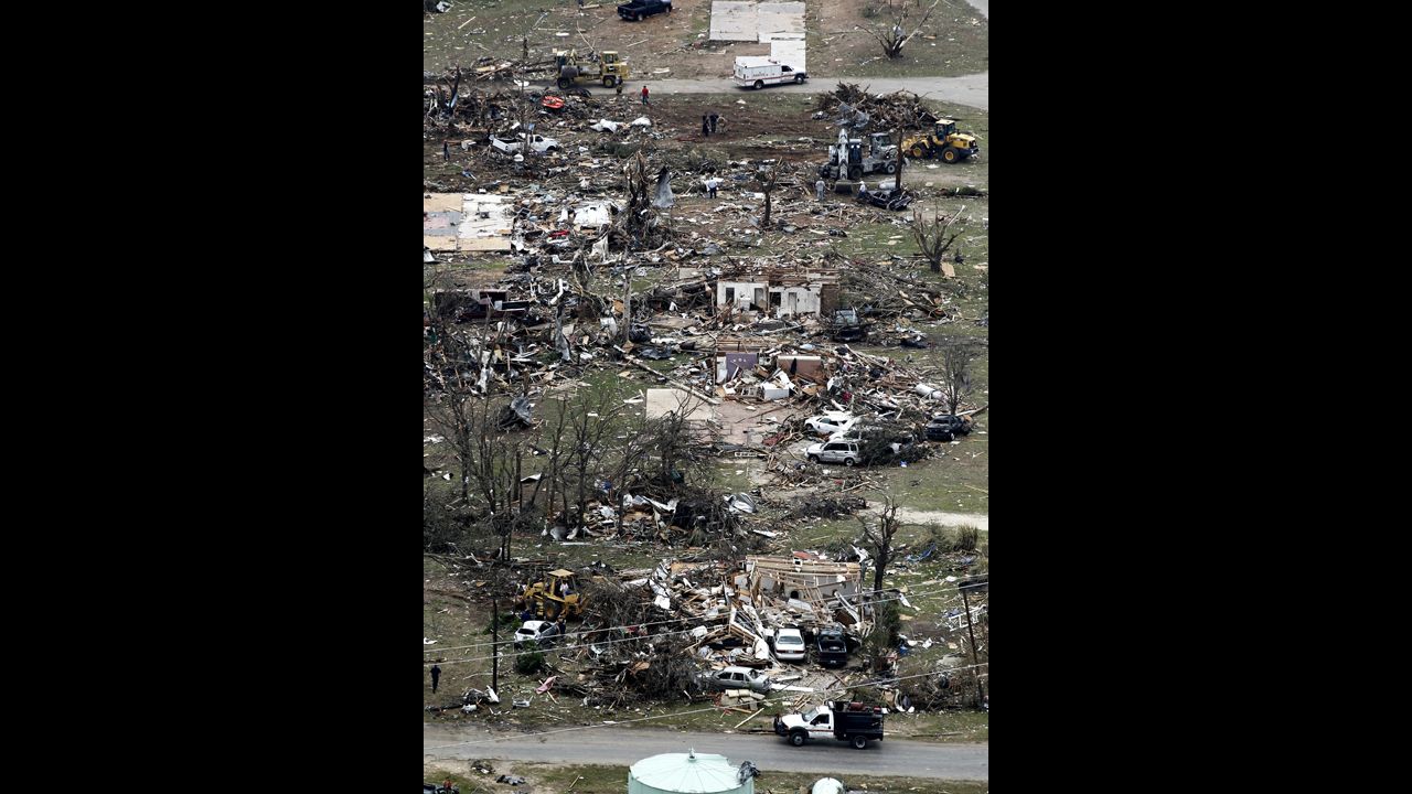Debris from damaged homes litters a neighborhood in Granbury on Thursday, May 16.