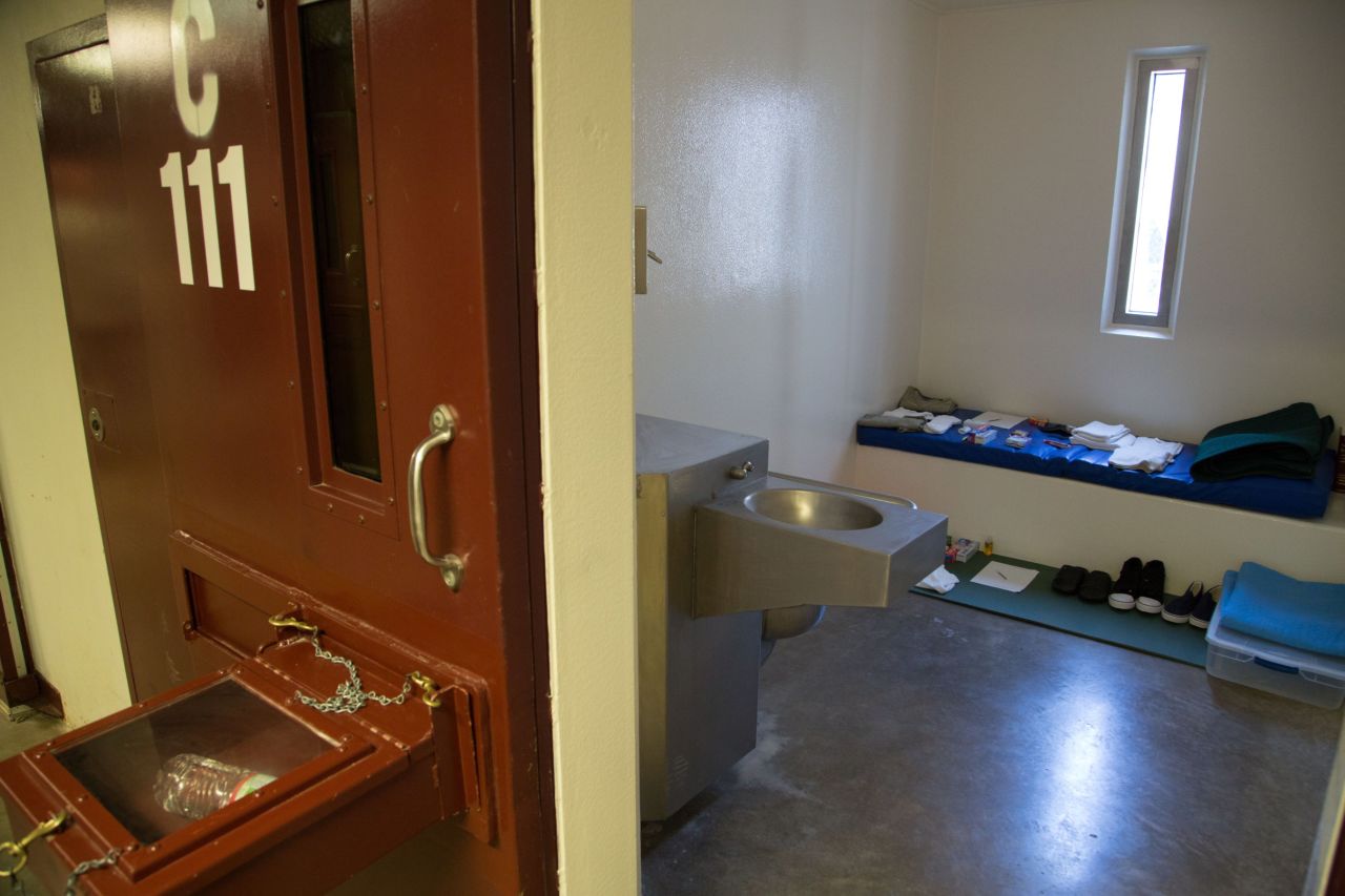 The box protruding from a cell door is known as a "splash box."  It is used to keep detainees from being able to splash guards with bodily fluids, a practice that has become a daily occurrence since the start of the hunger strike.  