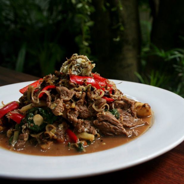 Tourists will find this Cambodian insect dish slightly more appealing than the giant spiders. Mixed in with beef and holy basil, the red tree ants add a sour flavor to this stir-fried dish. 