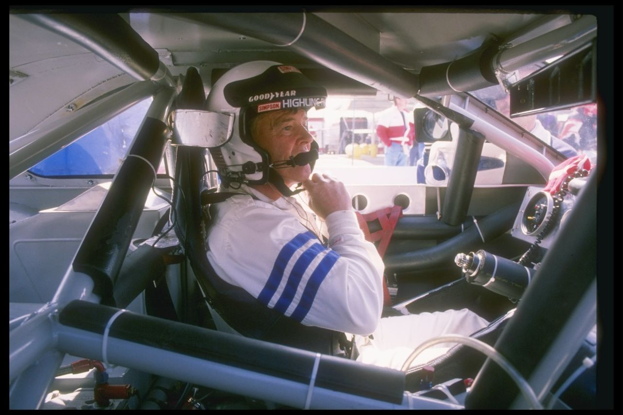 Dick Trickle sits in his car before the start of a NASCAR race in 1993.