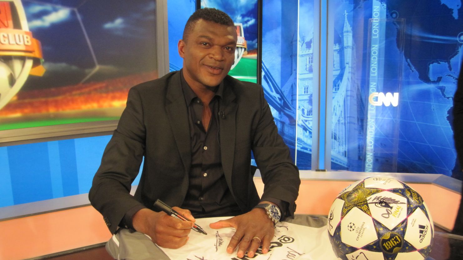 France World Cup star Marcel Desailly signs our special shirt and Champions League ball.