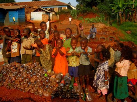 Using thousands of waste bottles, the talented artist turned a school yard in Kampala's Kireka community into a fun and safe place where children can play and learn.