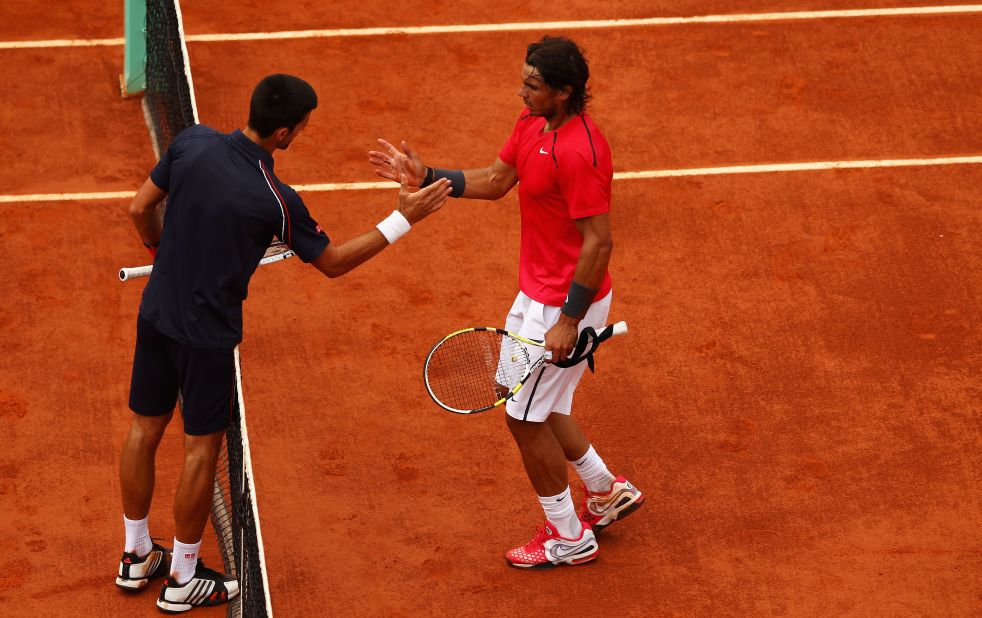 Novak Djokovic shakes hands with Rafael Nadal after losing to the "King of Clay" in the French Open final last year. The Serbian needs to win the title at Roland Garros to join the seven men, Nadal included, who have achieved a career grand slam.