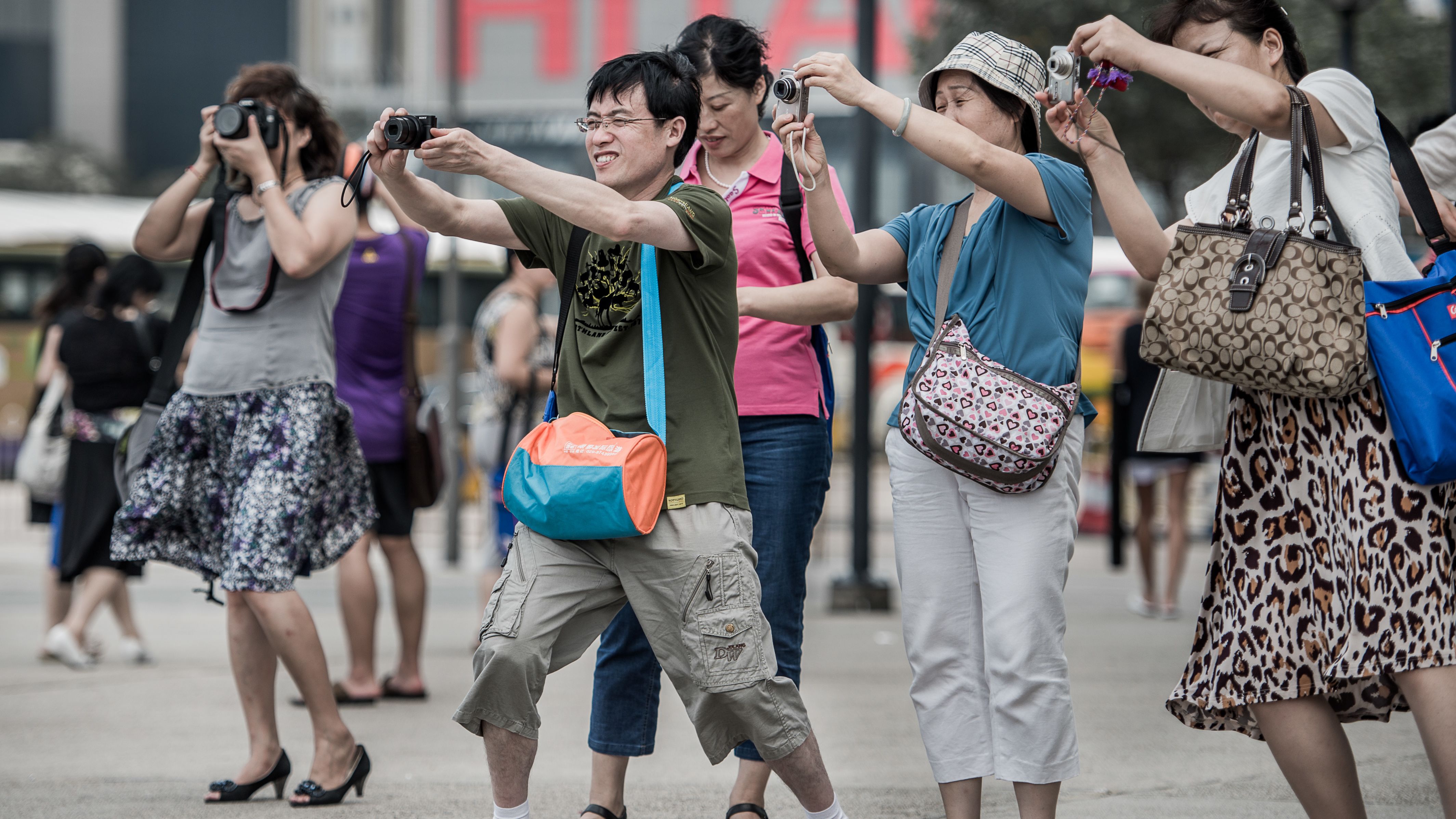 Mainland Chinese tourists break out the cameras to capture a special Hong Kong moment.