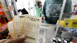 A customer purchases Powerball and Mega Millions lottery tickets in Decatur on May 17. The Powerball game is played in 43 states, the District of Columbia and the U.S. Virgin Islands.