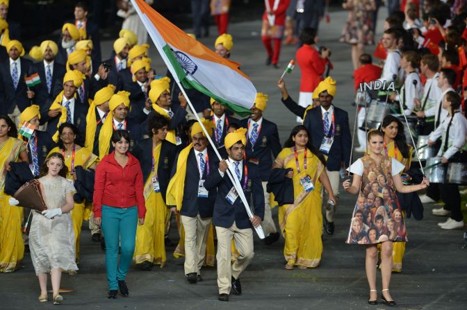 The Indian Olympic team's moment of glory at the 2012 London Games' Opening Ceremony was shared by a mystery woman in a red shirt and blue trousers who waved to the crowd as the delegation marched round the stadium. The woman was later revealed as Madhura Nagendra.