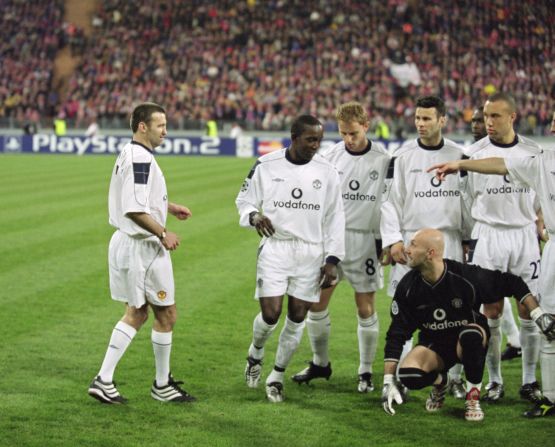 Karl Power, a Manchester United supporter, became an instant legend when he managed to sneak into Manchester United's pre-game team photo.