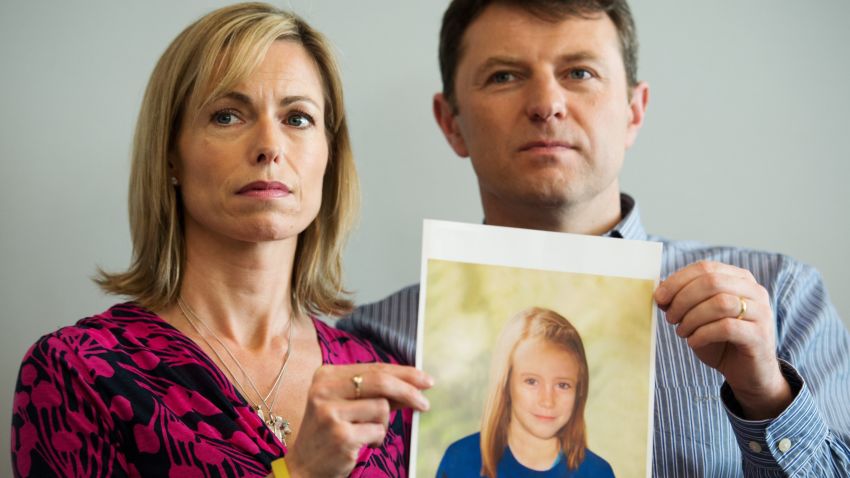 Parents of missing girl Madeleine McCann, Kate (L) and Gerry McCann (R) pose with an artist's impression of how their daughter might look now at the age of nine ahead of a press conference in central London on May 2, 2012 five years after Madeleine's disappearance while on a family holiday in Portugal. Aged three at the time, the artist's impression depicts how Madeleine may now look, based on family photos of her, along with childhood images of her parents. AFP PHOTO / LEON NEAL (Photo credit should read LEON NEAL/AFP/GettyImages)