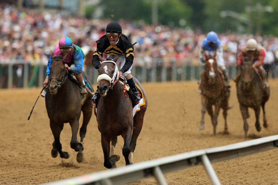 Stevens and Oxbow hold off itsmyluckday, ridden by John Velazquez, at the finish line to win the Preakness Stakes. 