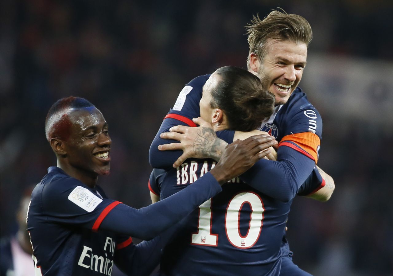 Beckham hugs star striker Zlatan Ibrahimovic after the Swede's early opener in PSG's final home match of the season.  