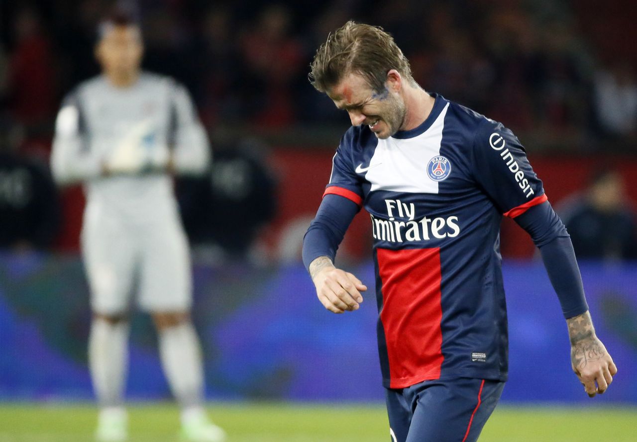 The emotion shows as David Beckham walks off the field after his late substitution at the Parc des Princes.