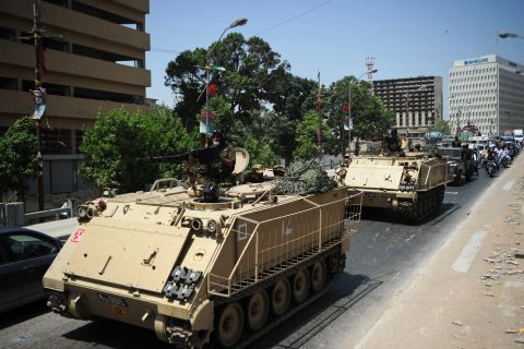 Pakistani tanks deploy near a voting station on May 18 ahead of a new vote in Karachi, where complaints of rigging and irregularities were reported in the general election May 11. The army is set to be deployed at 43 polling stations ahead of voting on May 19, a media report said.