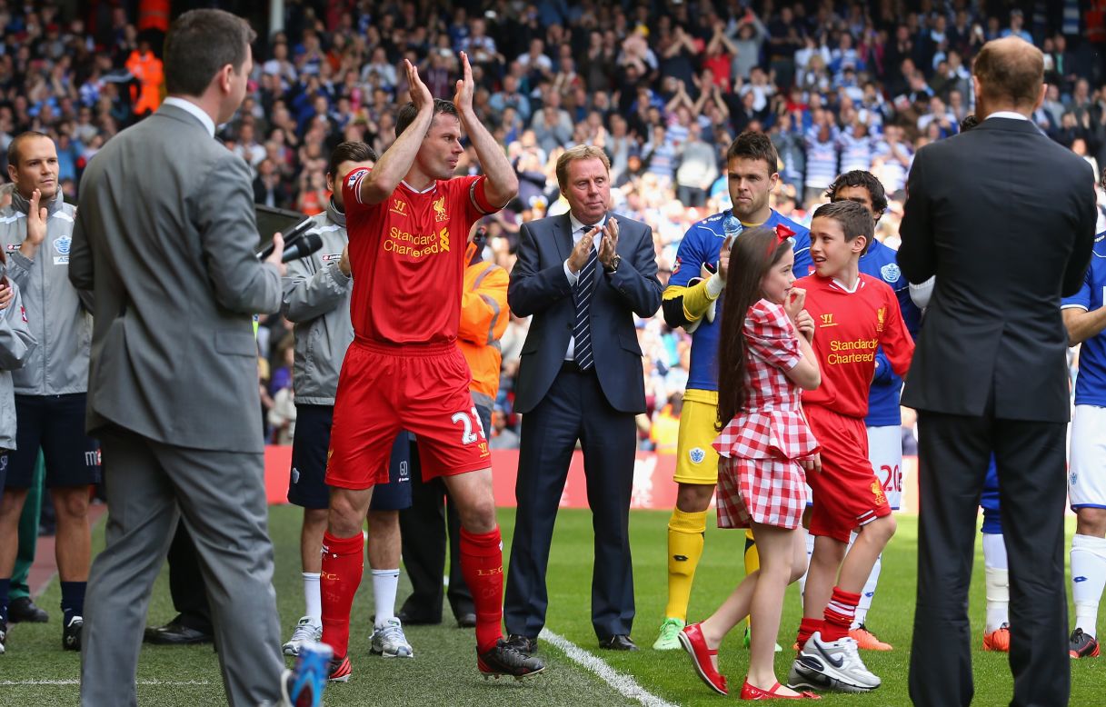 Jamie Carragher is applauded on to the pitch for his final game for Liverpool against Queens Park Rangers.