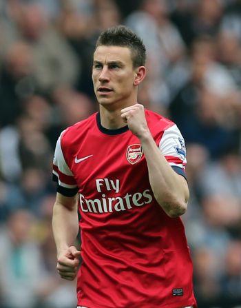 Laurent Koscielny celebrates his vital winner for Arsenal at Newcastle as they clinched fourth spot in the EPL.  