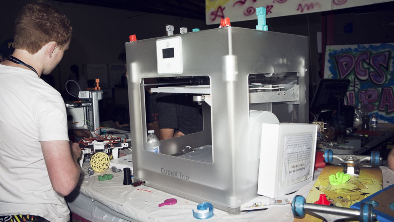3-D printers were everywhere at the 2013 Maker Faire. This $3,999 <a href="http://cubify.com/cubex/" target="_blank" target="_blank">CubeX Trio</a> is printing a small plastic guitar. 