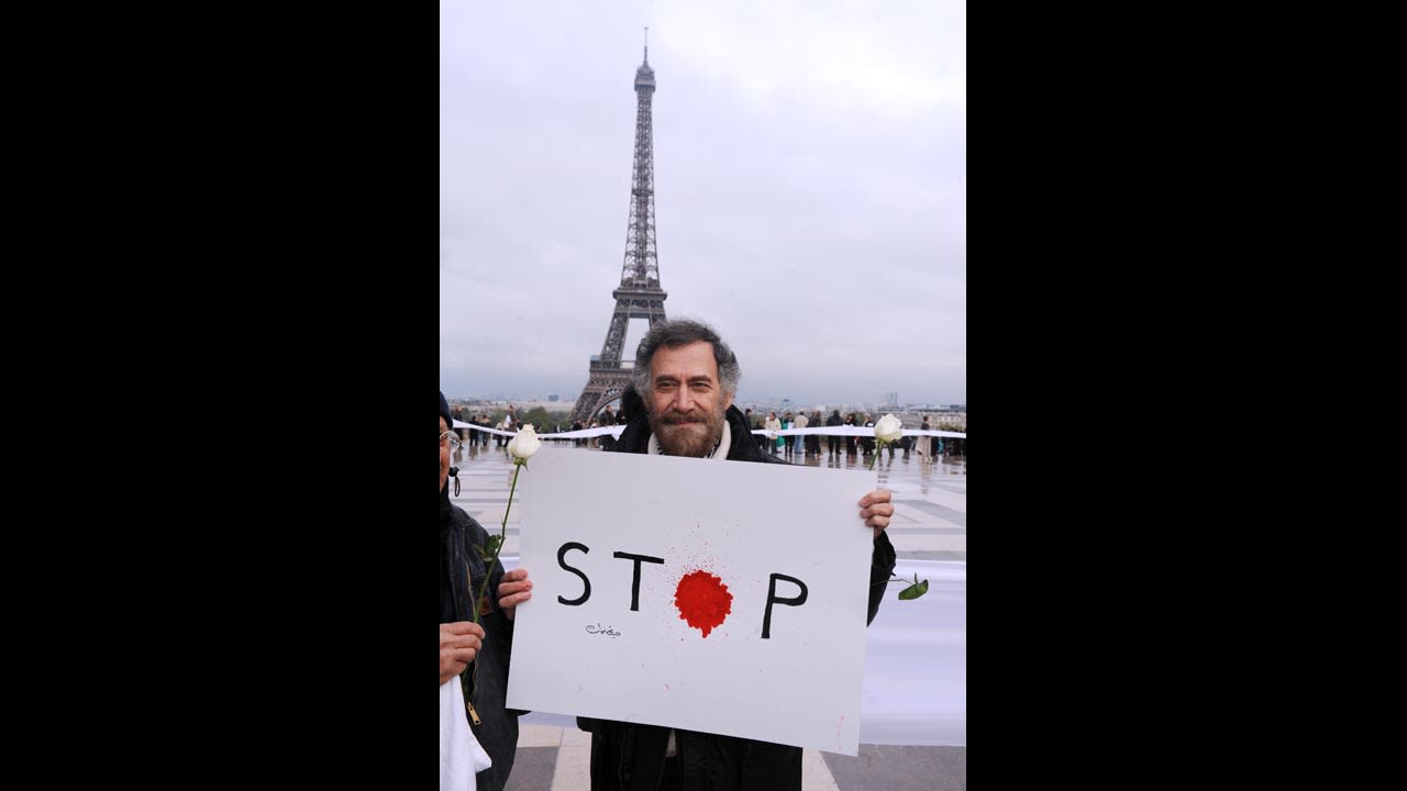 The artist, who now lives outside Syria, protests the violence in April 2012. He remains optimistic about the torn nation's future.