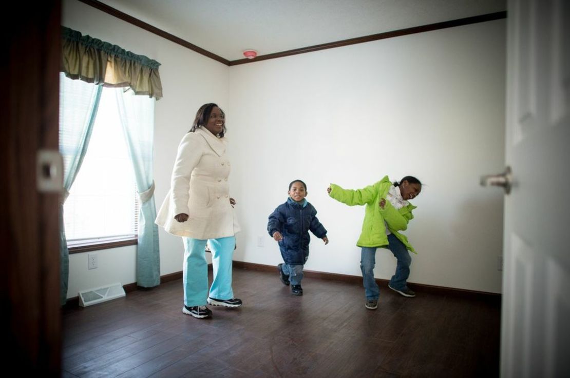  Affordable Housing Alliance beneficiaries Kaneisha Wilson and her two children set foot in their new home for the first time. The displaced family's Beachwood, New Jersey, property suffered extensive damage during Hurricane Sandy.