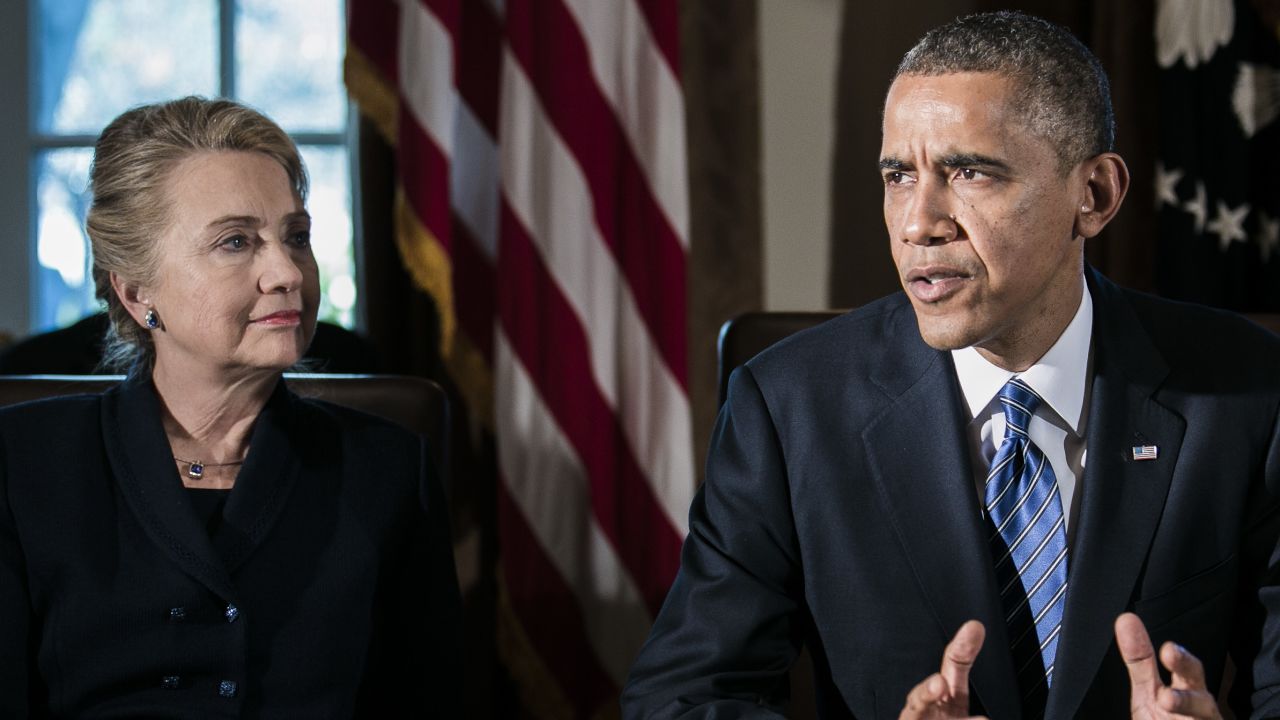 WASHINGTON, DC - NOVEMBER 28:  (AFP OUT) U.S. President Barack Obama (R) speaks as U.S. Secretary of State Hillary Clinton listens at a cabinet meeting at the White House on November 28, 2012 in Washington, DC. The president met yesterday with small business owners and today with the chief executives of major corporations in ongoing talks about the looming fiscal cliff.  (Photo by T.J. Kirkpatrick-Pool/Getty Images)