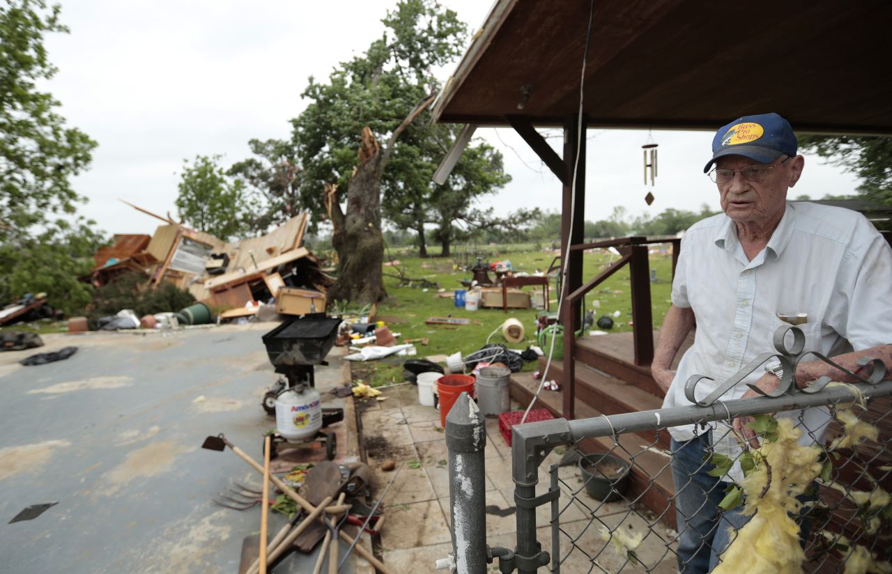 Lonnie Langston says his garage was swept off the concrete pad next to his house by a tornado near Shawnee. 
