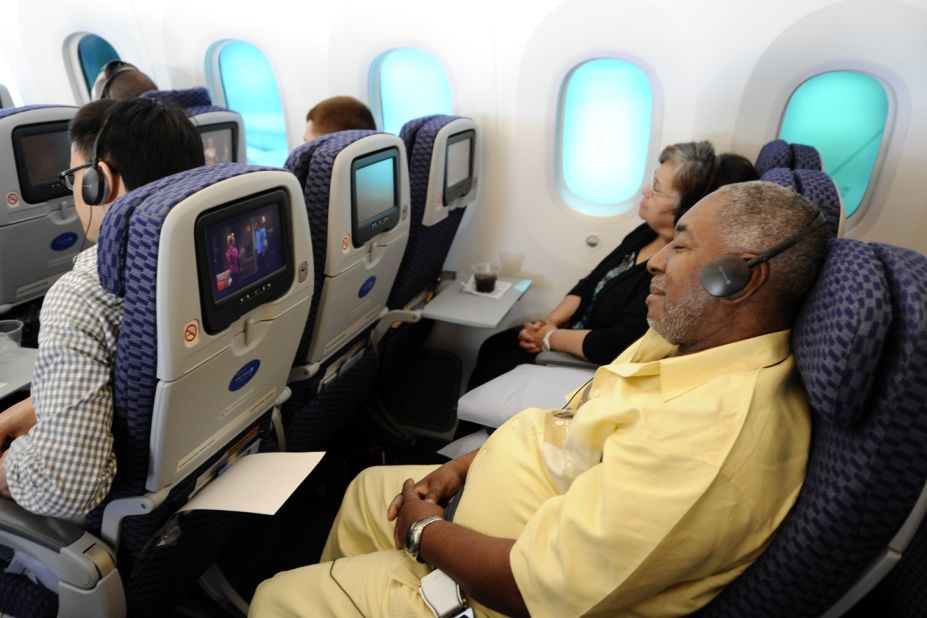 Michael Reynolds of St. Louis, Missouri, reclines during the flight to Chicago.